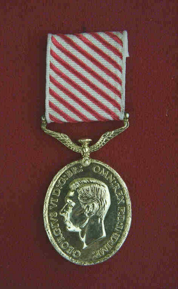 Air Force Medal.  An oval, silver medal, 1.375 inches wide and 1.625 inches long.