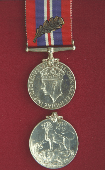 War Medal 1939-1945.  A circular, (.800 fine) silver medal, 1.42 inches in diameter.