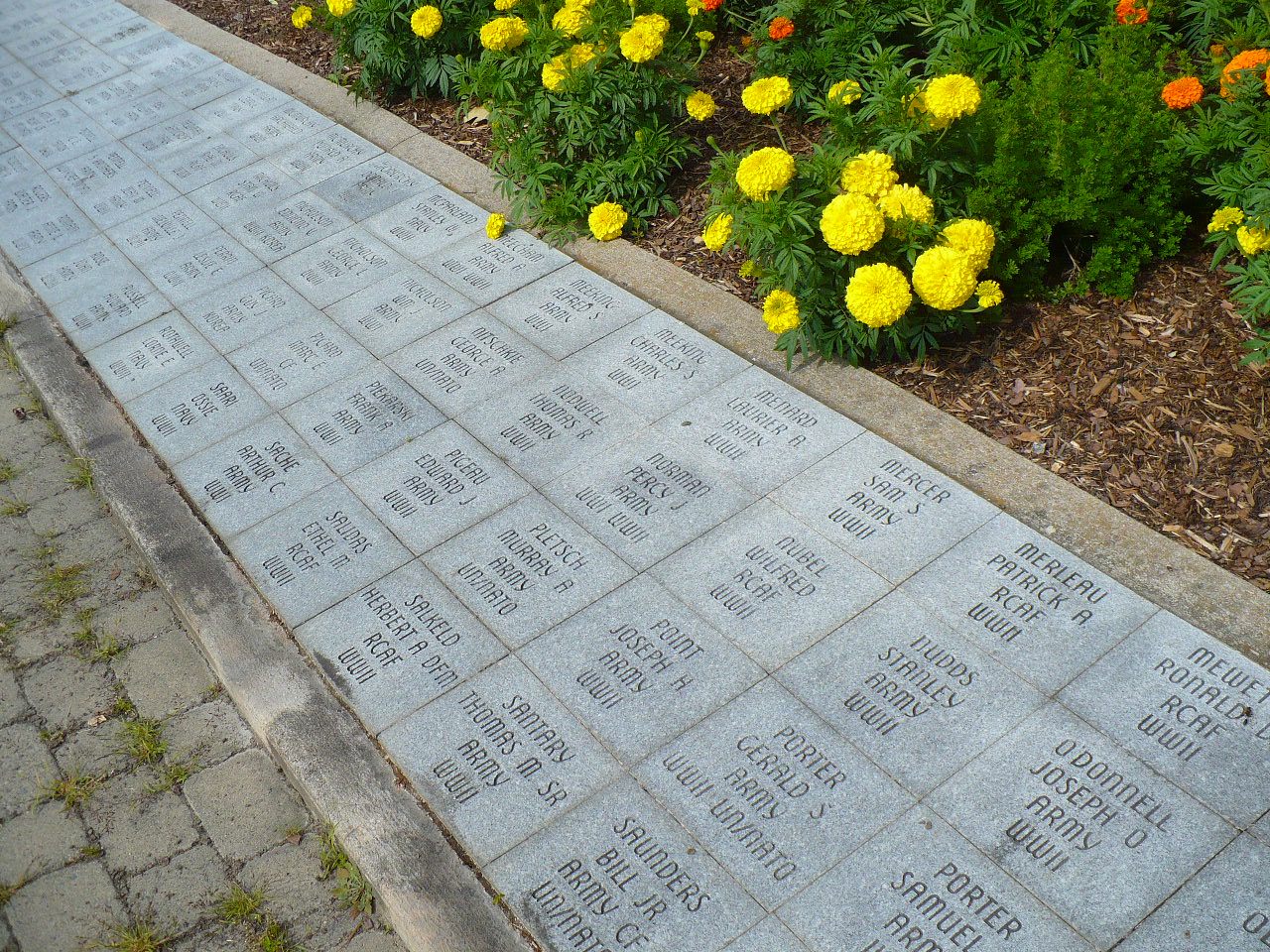 Commemorative stones recognizing Veterans who survived the wars.