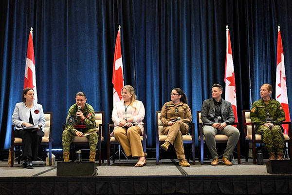 A panel of women Veterans on a stage.