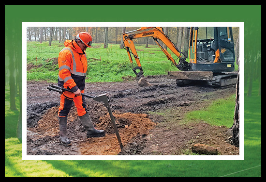 A worker located on the former battlefields outdoors at Vimy in search of First World War remnants