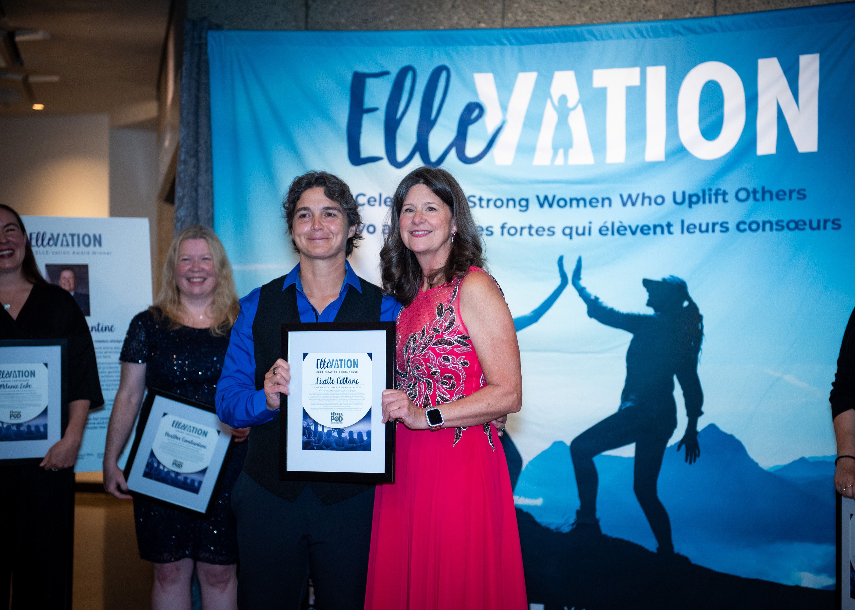 Lizette LeBlanc (left) receives her 2025 ELLE-vation Award from Sandra Perron (right). 