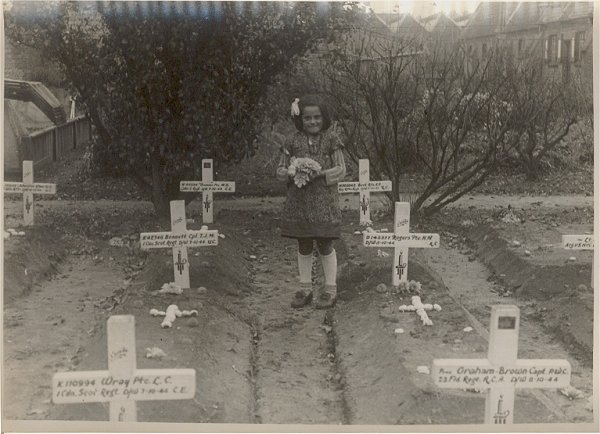 A little girl delivering flowers to the Fallen Canadians