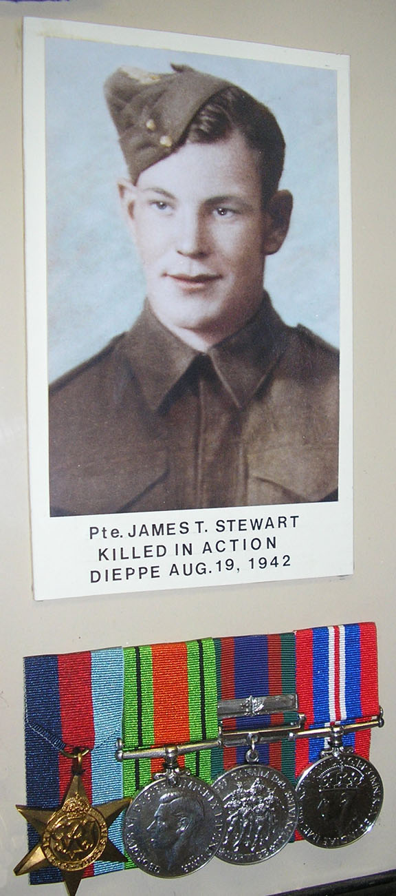 Photo of James Thomas Stewart and medals