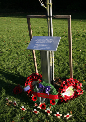Plaque, tree and wreaths