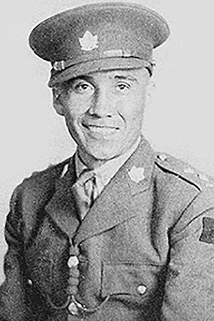 Chief Joseph Dreaver in war bonnet and traditional regalia